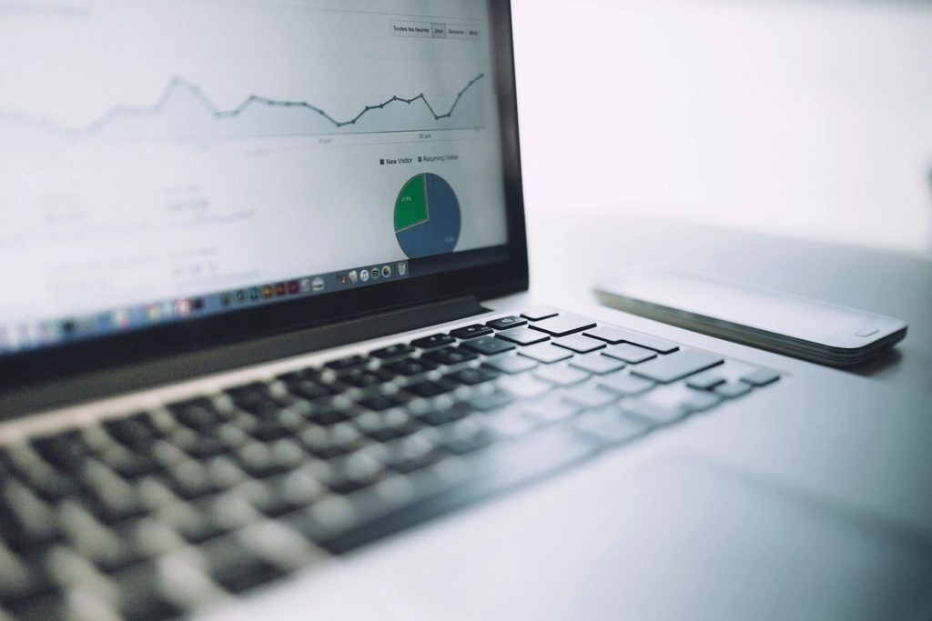 Laptop showing business analytics and charts