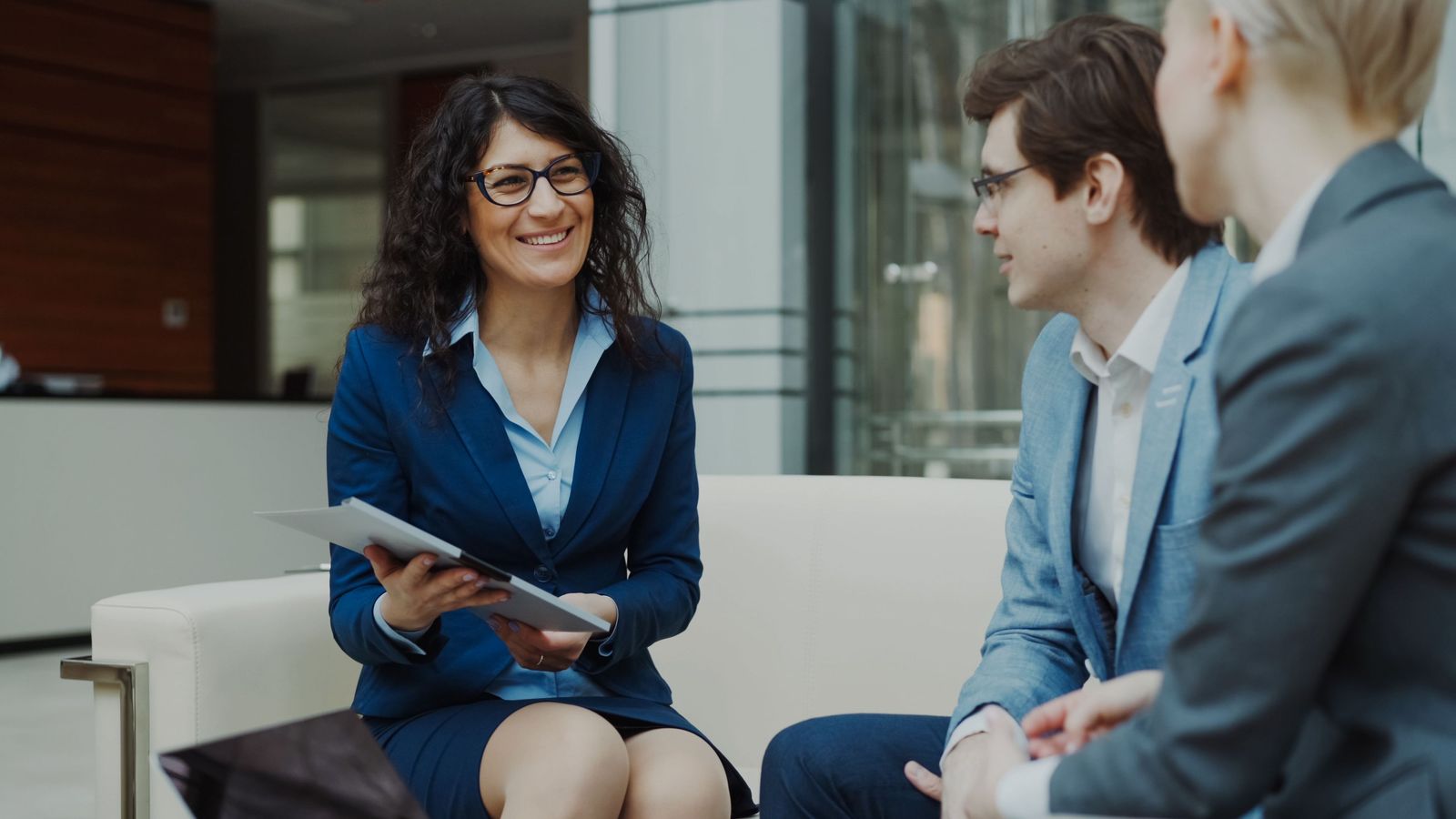 Business consultants discussing strategy in a modern office