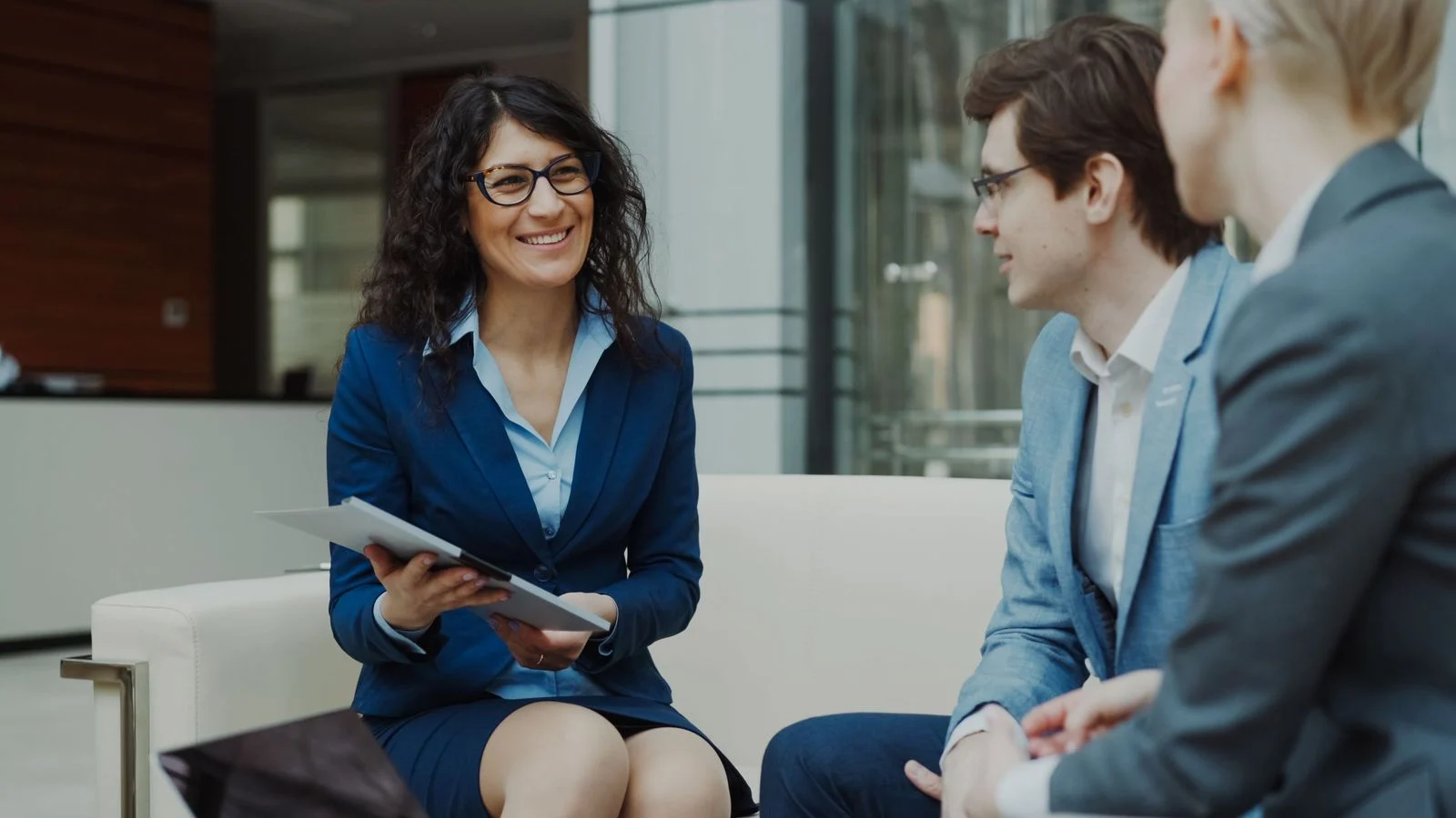 Business consultants discussing strategy in a modern office