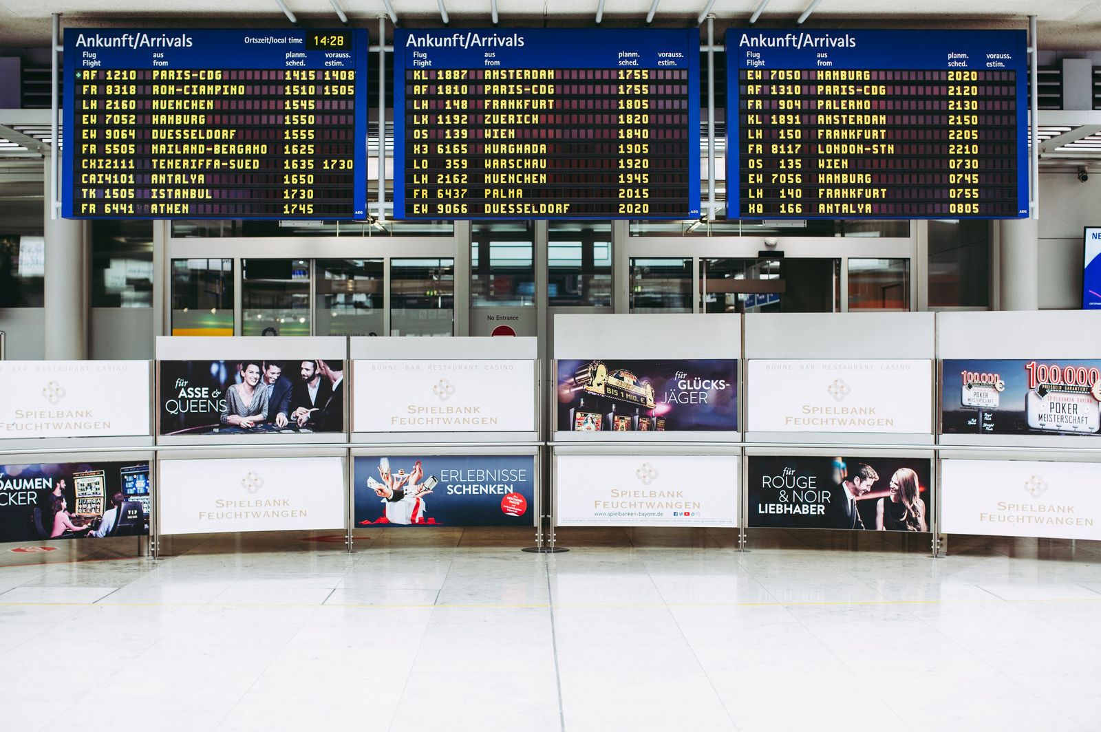 Digital signage displays showing live information in a public space