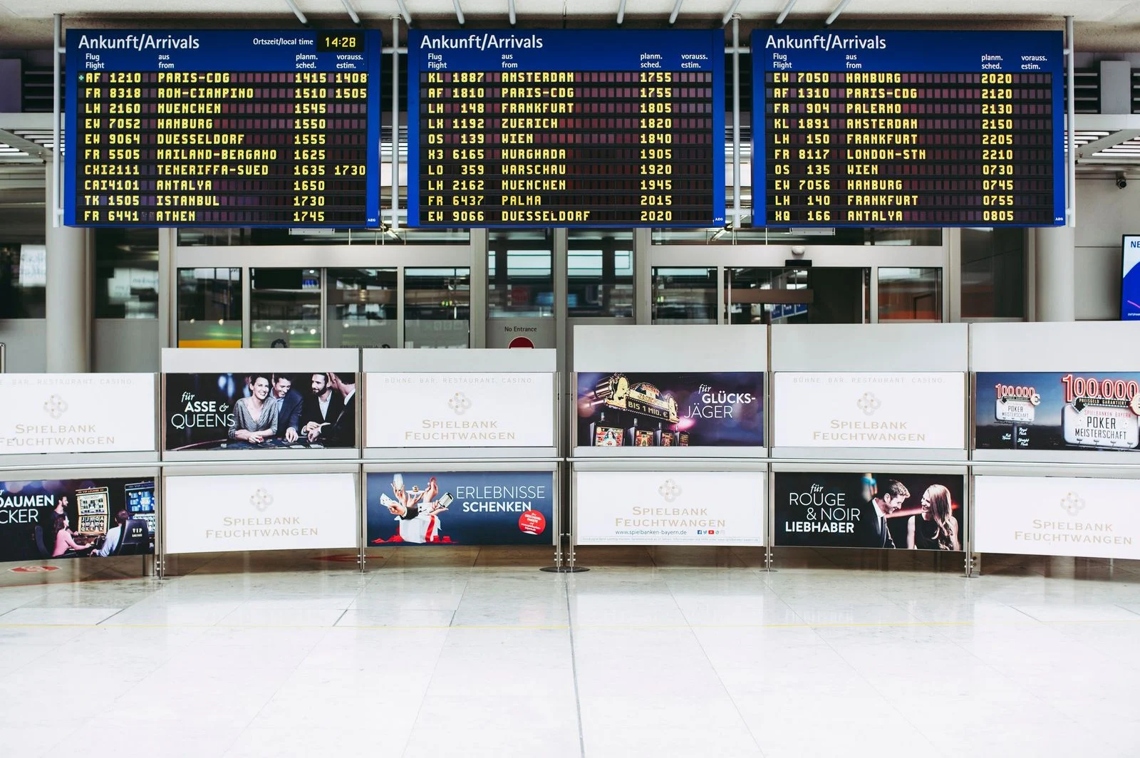 Digital signage displays showing live information in a public space