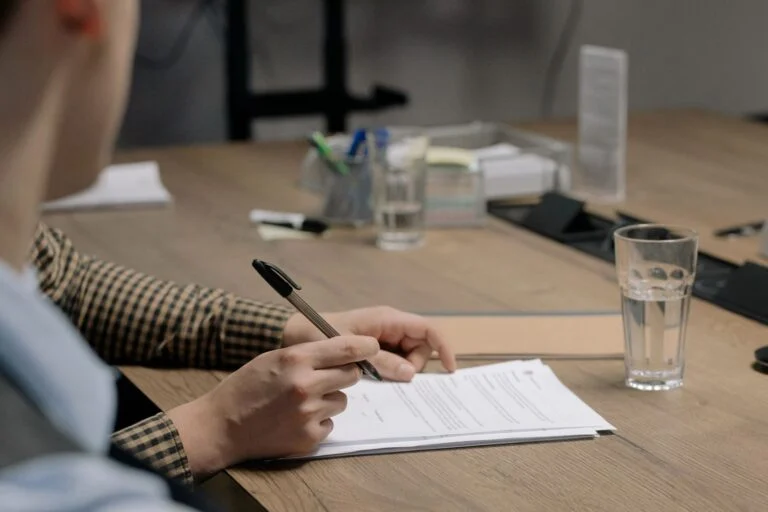Founder signing company formation documents in an office