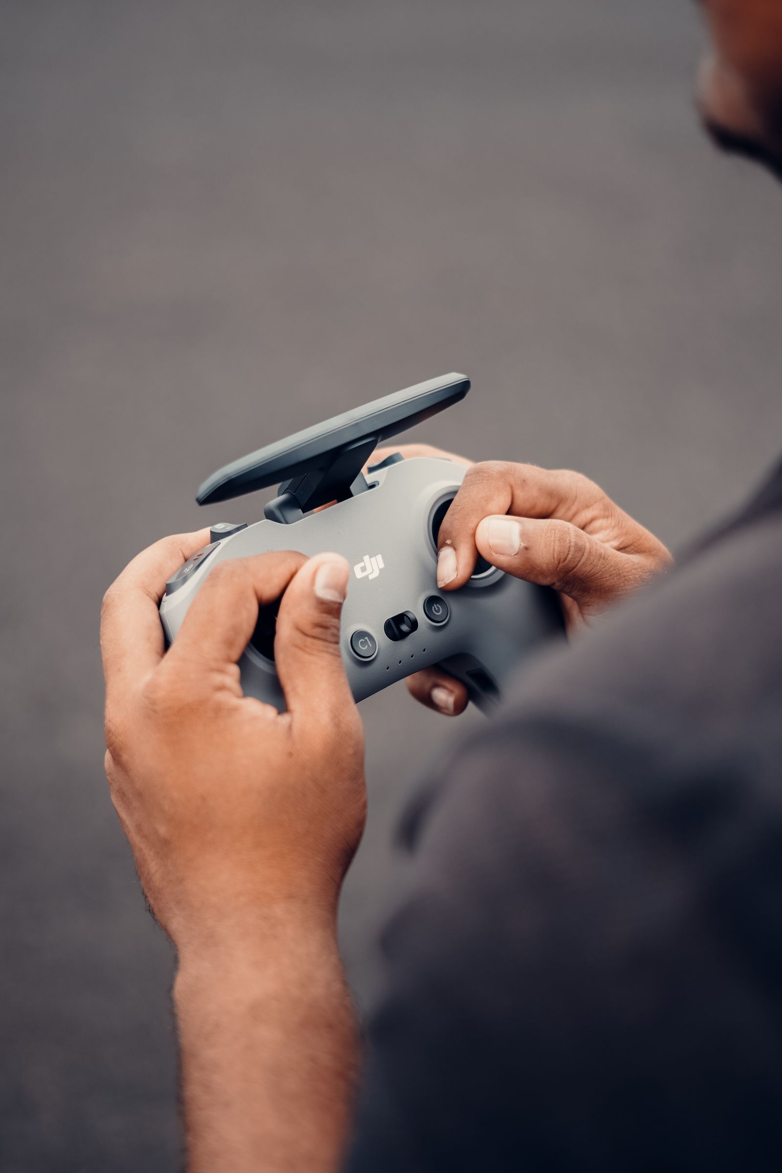 Drone pilot holding a controller preparing a commercial flight in Greece