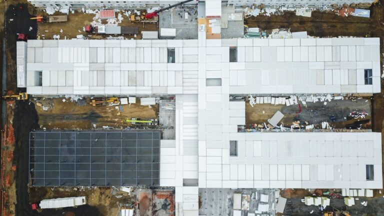Aerial drone view of a construction site with unfinished buildings