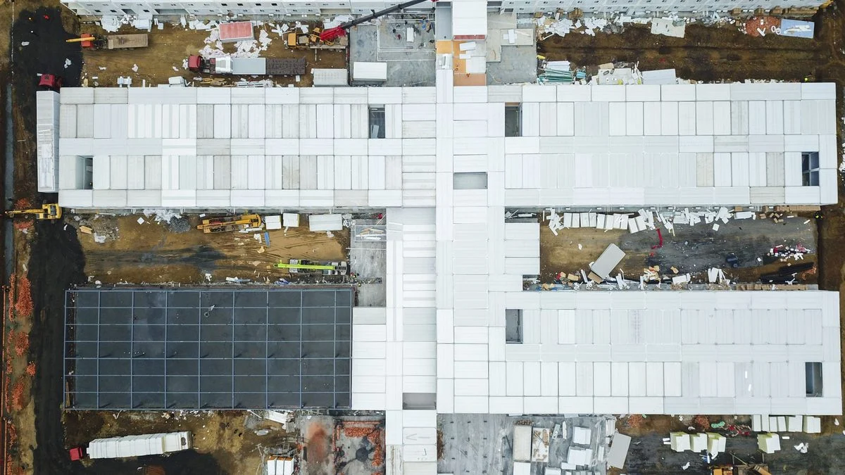 Aerial drone view of a construction site with unfinished buildings