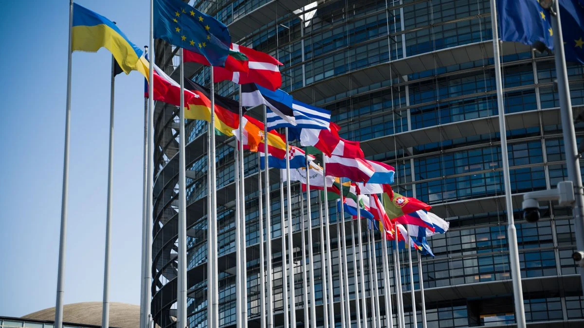 European Union flags outside a modern building